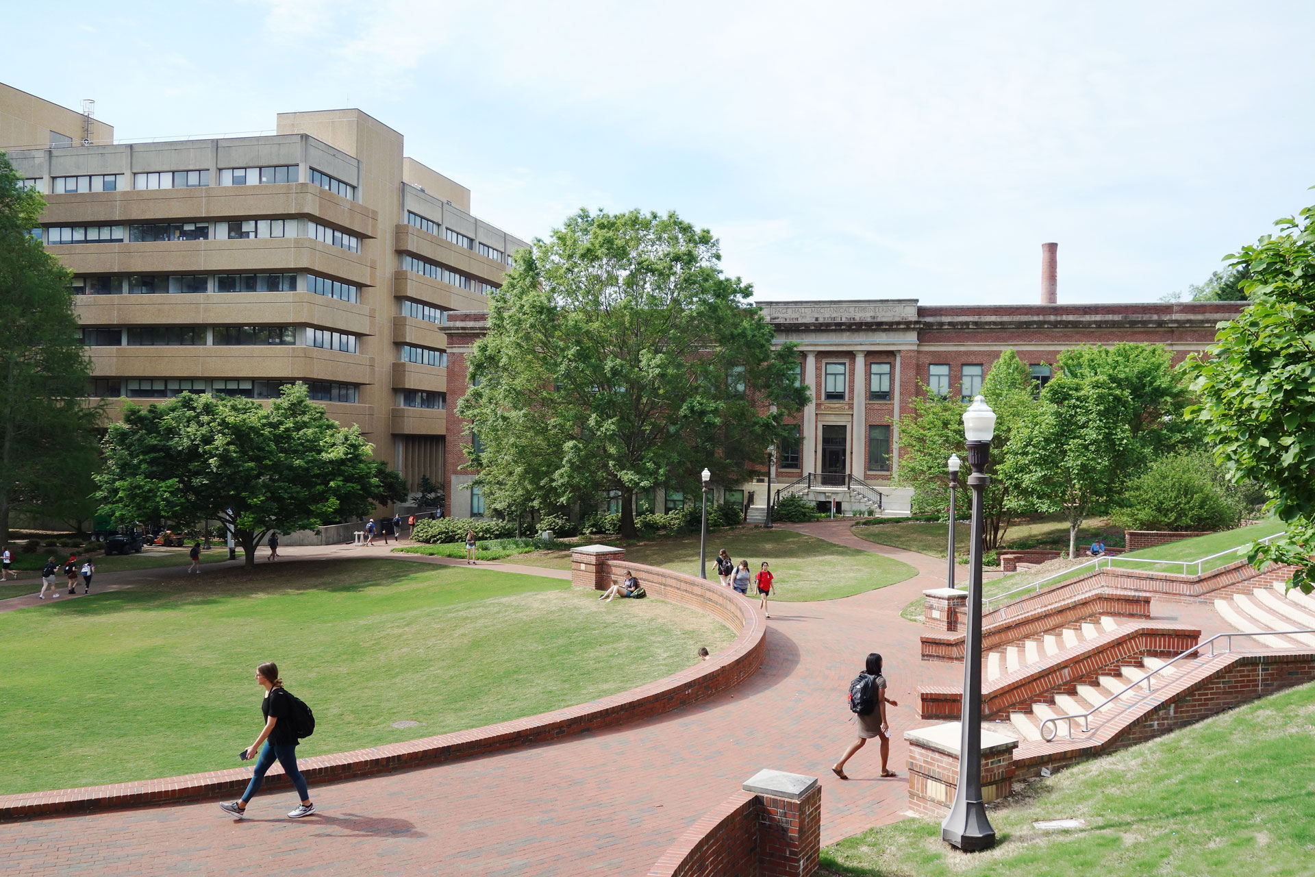 Strategic-Response-to-Education-Governance-Pressures Students walking on a College campus